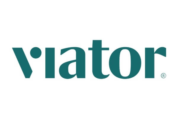 The logo of Viator, a travel website, features the company name in green lowercase letters on a white background.